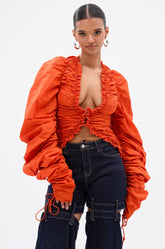 IN IT TO WIN IT RUCHED BLOUSE